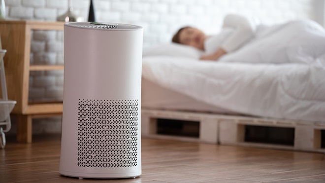 air purifier with a woman sleeping